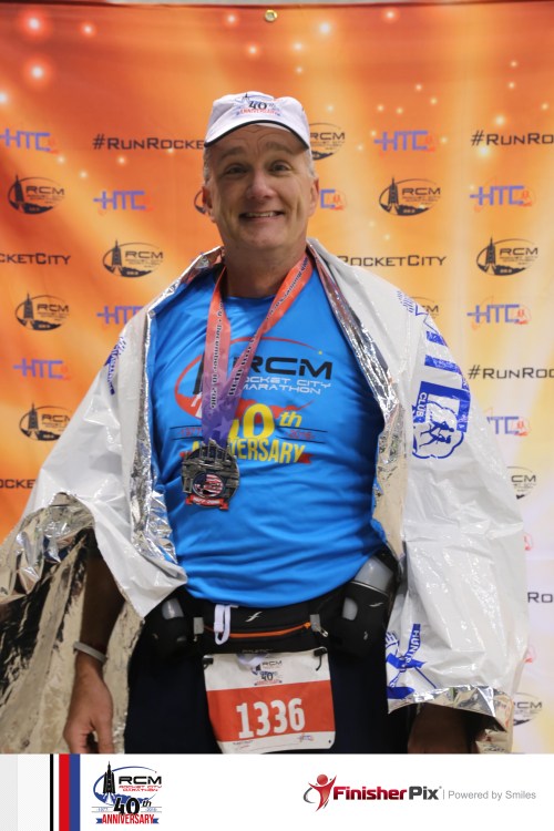 Not all heroes wear capes. But most marathoners do