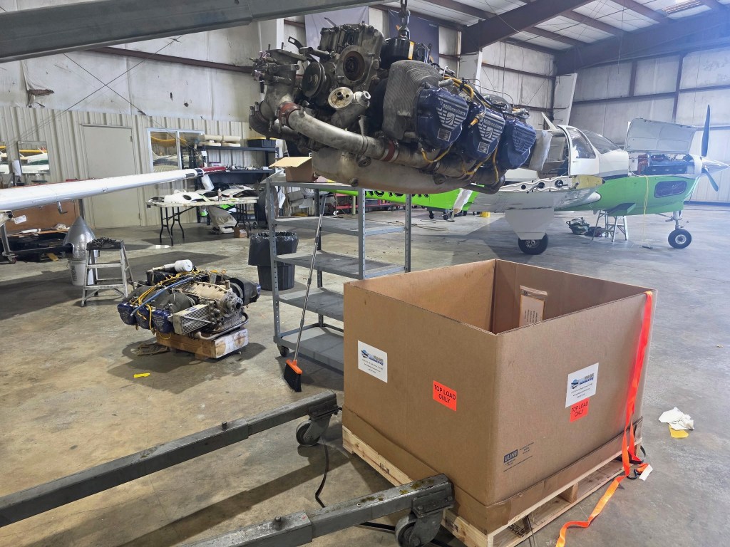 view of an IO-470-L engine on a chain hoist